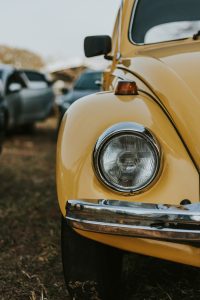 close up photo of yellow Volkswagon with big headlight